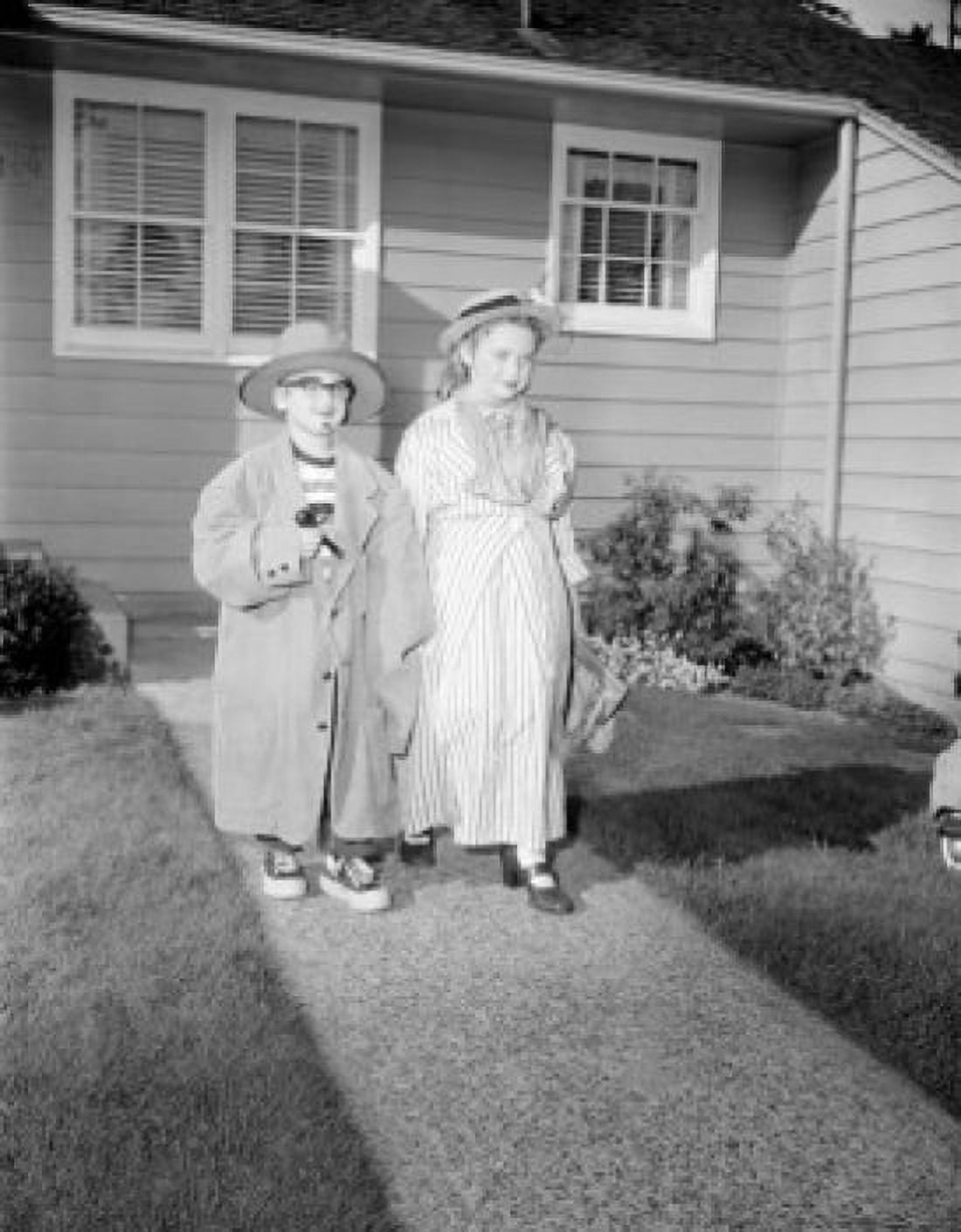 Brother and sister dressing up and walking Canvas Art - (18 x 24)
