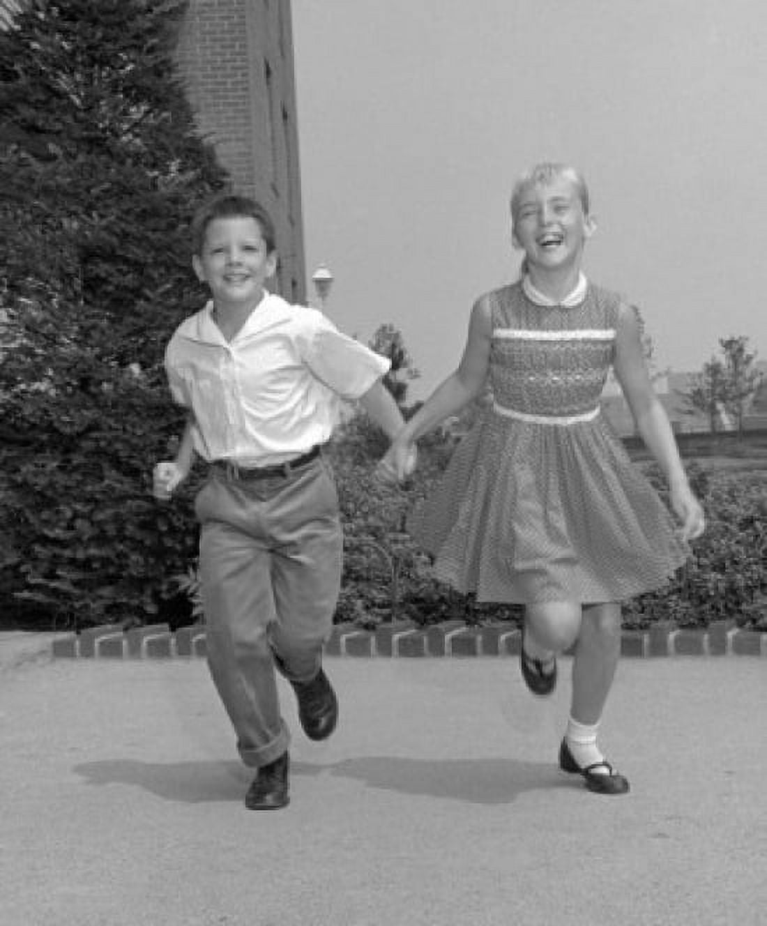 Brother and sister holding hands and running Canvas Art - (18 x 24)