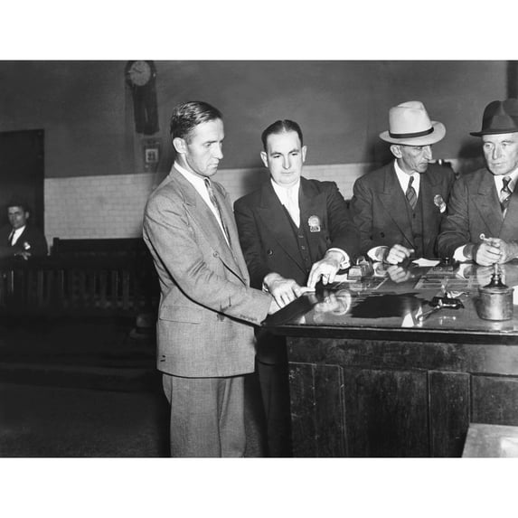 Bruno Hauptmann Fingerprinted After His Arrest For The Possession Of Lindbergh Ransom Money. At Police Headquarters