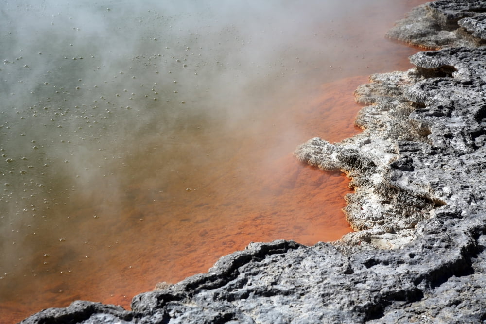 Bubbles rising in Champagne Pool hot spring Wai-O-Tapu Geothermal area New Zealand Canvas Art - Richard RoscoeStocktrek Images (35 x 23)