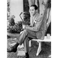 thumbnail image 1 of Buddy Rogers holding a golf club Photo Print (24 x 30), 1 of 1