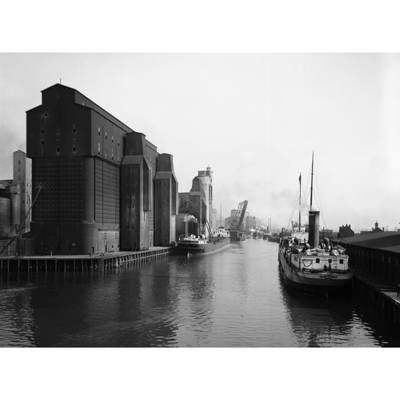 Buffalo Canal Harbor. Nsteamboats And Grain Elevators In The Canal Harbor Buffalo New York. Photograph C1910-1920.