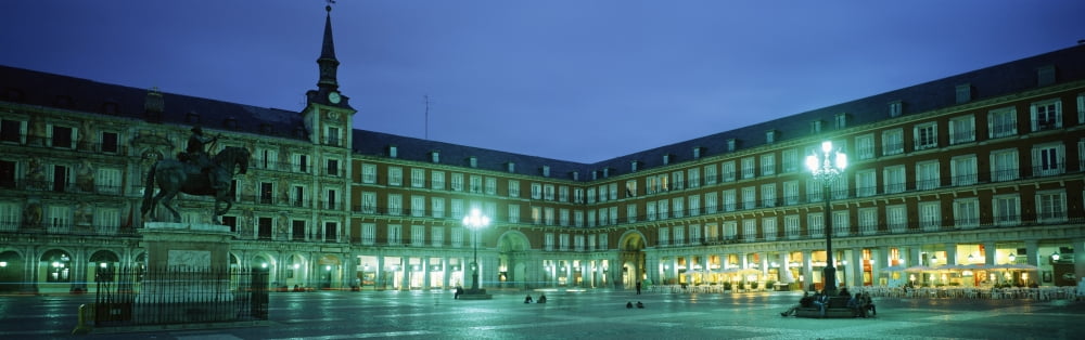 Building lit up at dusk Plaza Mayor Madrid Spain Canvas Art - Panoramic Images (12 x 36)