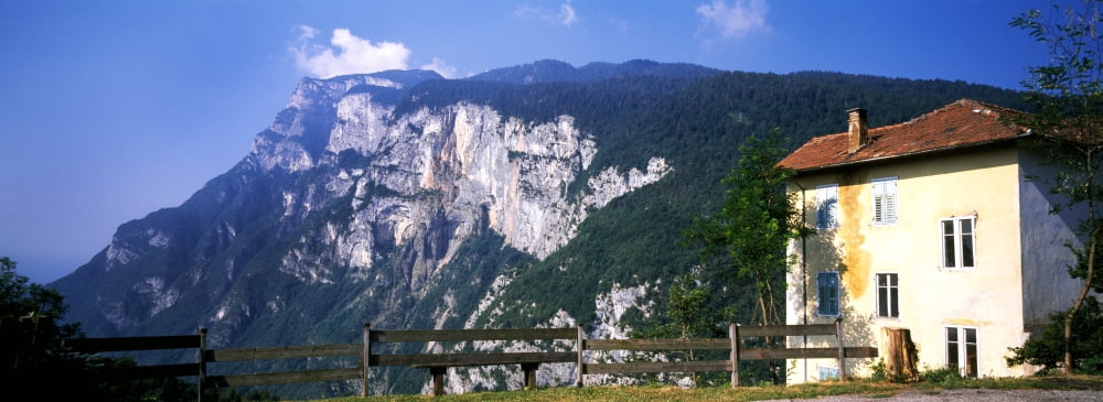 Building with mountain range in the background Terlago Trentino Italy Canvas Art - Panoramic Images (27 x 9)