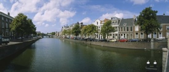 Buildings along a canal Haarlem Netherlands Canvas Art - Panoramic Images (30 x 13)