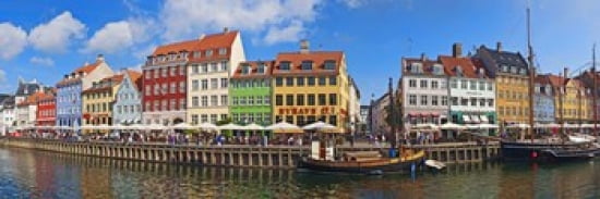 Buildings along a canal with boats Nyhavn Copenhagen Denmark Canvas Art - Panoramic Images (36 x 12)