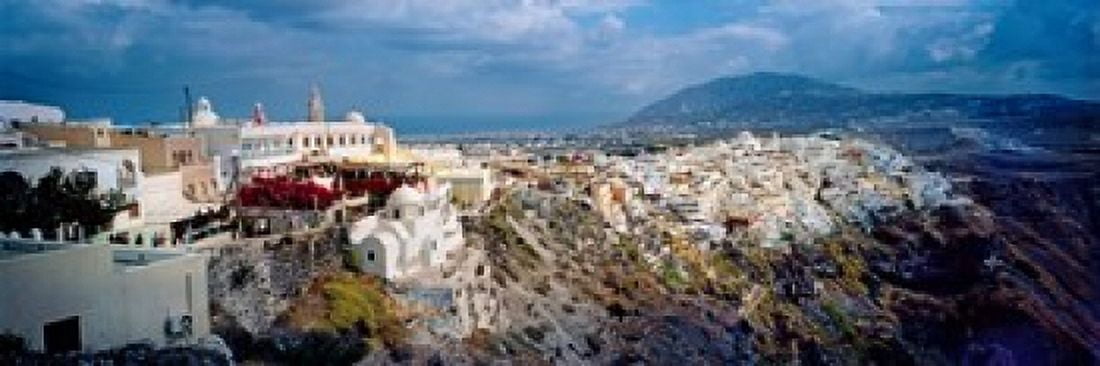 Buildings along rugged hillside Santorini Greece Canvas Art - Panoramic Images (18 x 6)