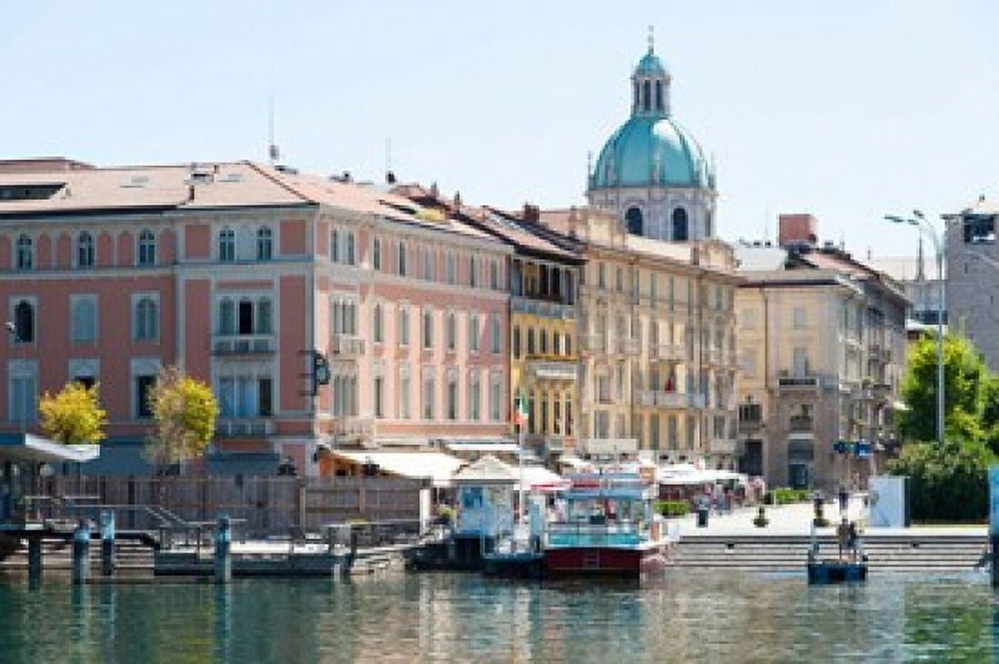 Buildings alongside Lake Como at Piazza Cavour Como Lombardy Italy Canvas Art - Panoramic Images (36 x 24)