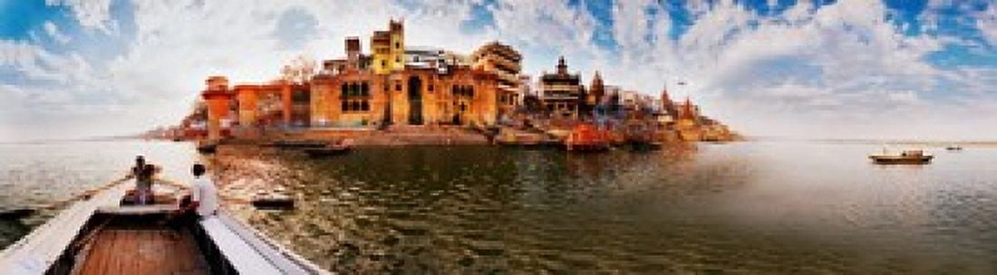 Buildings at riverbank viewed from a boat Ganges River Varanasi Uttar Pradesh India Canvas Art - Panoramic Images (40 x 12)