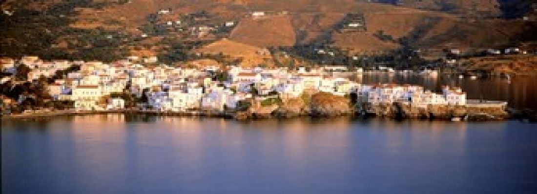 Buildings at the waterfront Andros Cyclades Islands Greece Canvas Art - Panoramic Images (18 x 7)