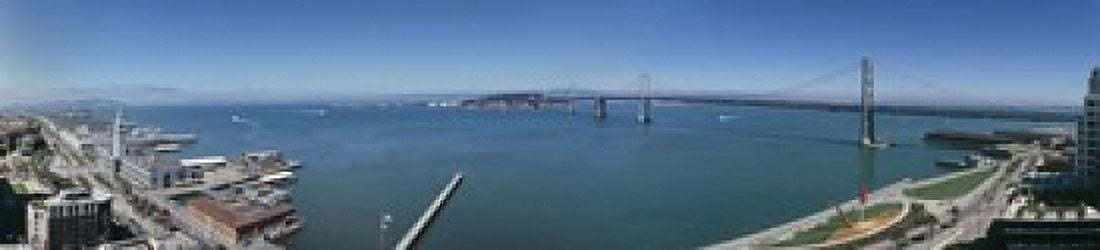 Buildings at the waterfront Golden Gate Bridge San Francisco Bay San Francisco California USA Canvas Art - Panoramic Images (22 x 5)