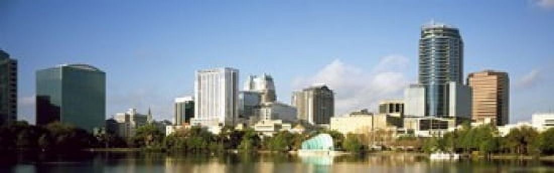 Buildings at the waterfront Lake Eola Orlando Orange County Florida USA 2010 Canvas Art - Panoramic Images (18 x 6)