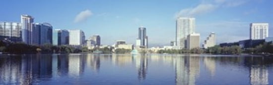 Buildings at the waterfront Lake Eola Orlando Orange County Florida USA 2010 Canvas Art - Panoramic Images (36 x 12)