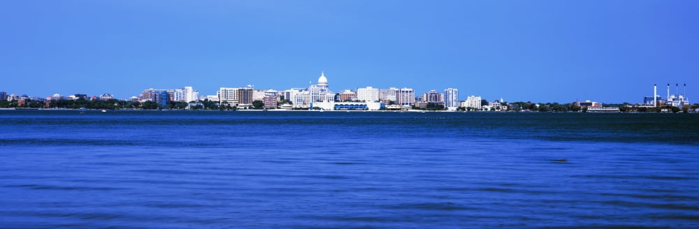 Buildings at the waterfront Lake Monona Madison Wisconsin USA Canvas Art - Panoramic Images (12 x 36)