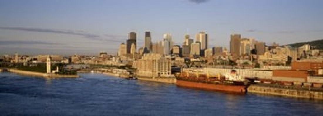 Buildings at the waterfront Montreal Quebec Canada Canvas Art - Panoramic Images (18 x 7)