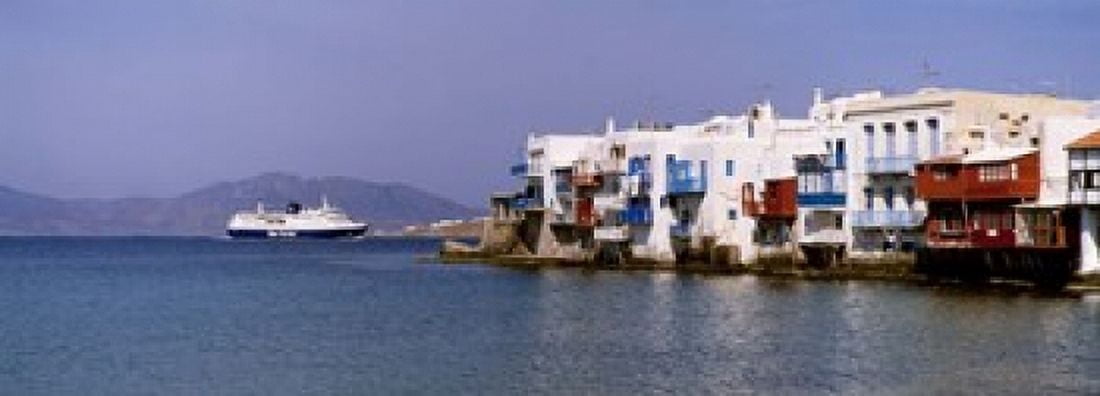 Buildings at the waterfront Mykonos Cyclades Islands Greece Canvas Art - Panoramic Images (18 x 7)