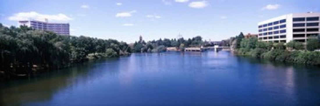 Buildings at the waterfront Spokane River Spokane Washington State USA Canvas Art - Panoramic Images (18 x 6)