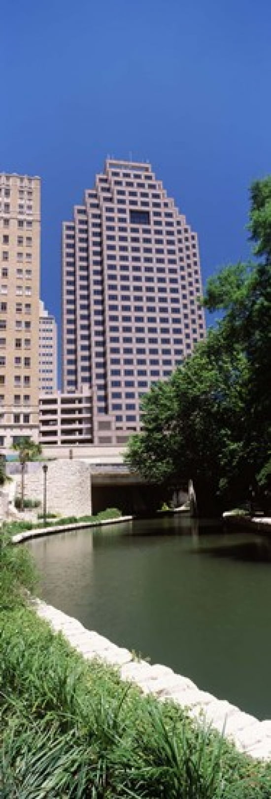 Buildings at the waterfront Weston Centre NBC Plaza San Antonio Texas USA Canvas Art - Panoramic Images (36 x 13)