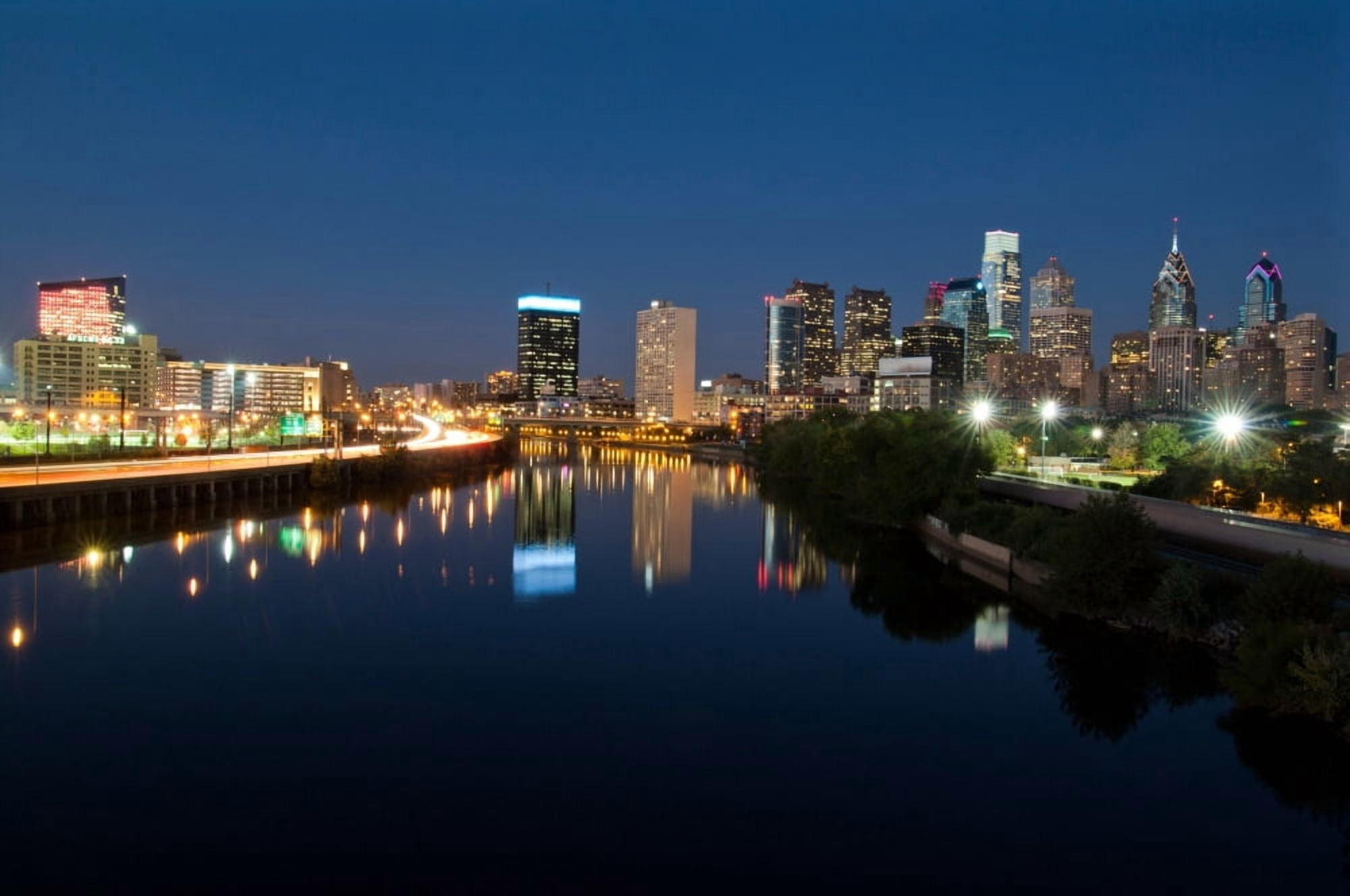 Buildings at the waterfront at night Delaware River Philadelphia Pennsylvania USA Canvas Art - Panoramic Images (12 x 36)