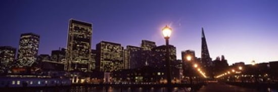 Buildings at the waterfront lit up at dusk San Francisco California USA Canvas Art - Panoramic Images (36 x 12)