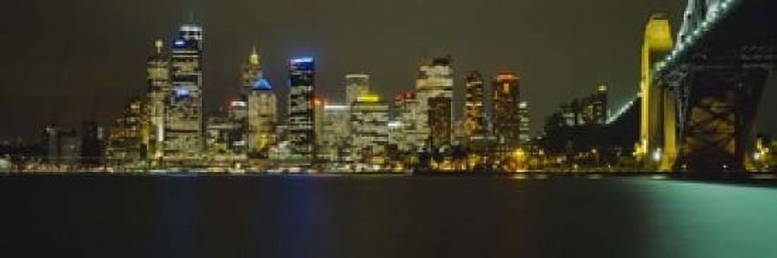 Buildings at the waterfront lit up at night Sydney Harbor Bridge Sydney New South Wales Australia Canvas Art - Panoramic Images (18 x 6)