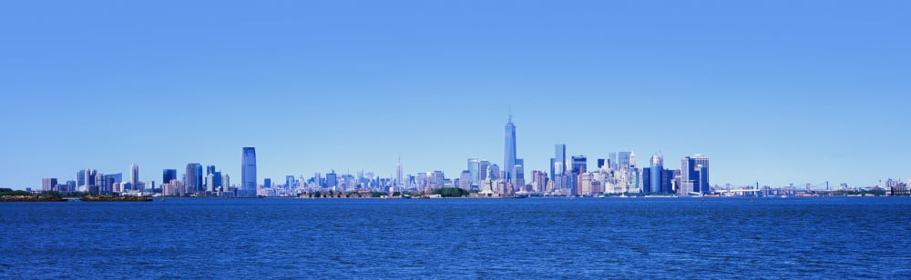 Buildings at waterfront New York City New York State USA Canvas Art - Panoramic Images (12 x 38)