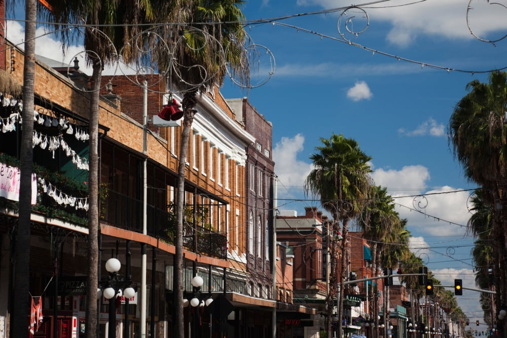 Buildings in a city La Septima East 7th Street Ybor City Tampa Florida USA Canvas Art - Panoramic Images (27 x 9)