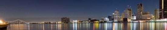Buildings in a city lit up at dusk Detroit River Detroit Michigan USA Canvas Art - Panoramic Images (44 x 9)