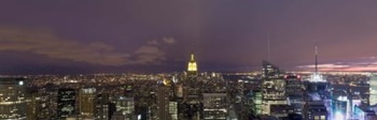 Buildings in a city lit up at dusk Midtown Manhattan Manhattan New York City New York State USA Canvas Art - Panoramic Images (36 x 12)