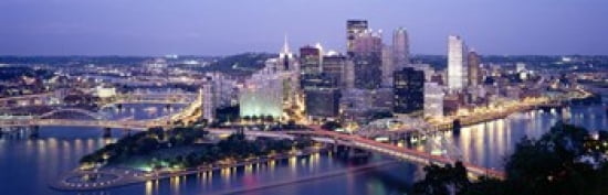 Buildings in a city lit up at dusk Pittsburgh Allegheny County Pennsylvania USA Canvas Art - Panoramic Images (36 x 12)