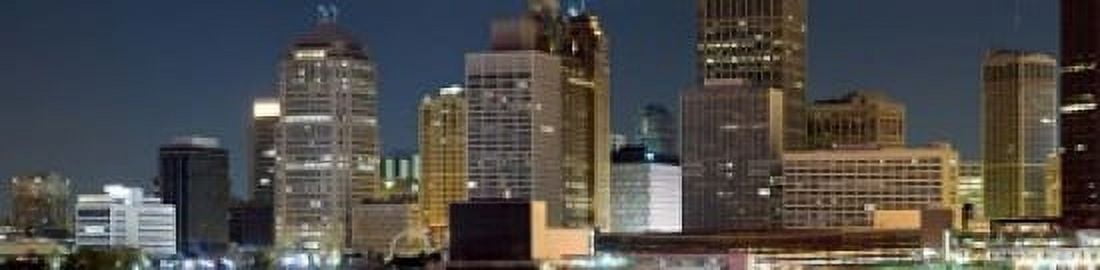 Buildings in a city lit up at night Detroit River Detroit Michigan USA Canvas Art - Panoramic Images (20 x 5)