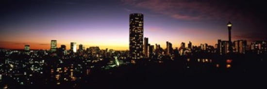 Buildings in a city lit up at night Johannesburg South Africa Canvas Art - Panoramic Images (36 x 12)
