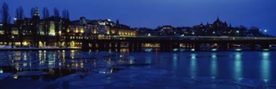 Buildings in a city lit up at night Sodermalm Slussplan Stockholm Sweden Canvas Art - Panoramic Images (36 x 12)