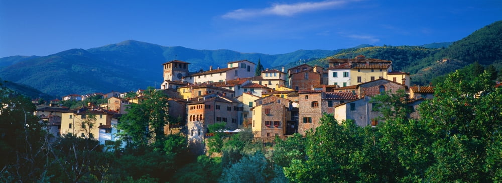 Buildings in a town Loro Ciuffenna Tuscany Italy Canvas Art - Panoramic Images (36 x 12)