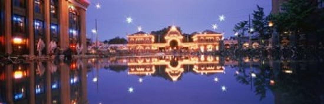 Buildings in an amusement park lit up at dusk Tivoli Gardens Copenhagen Denmark Canvas Art - Panoramic Images (18 x 6)