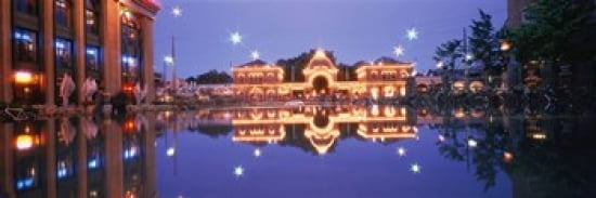 Buildings in an amusement park lit up at dusk Tivoli Gardens Copenhagen Denmark Canvas Art - Panoramic Images (36 x 12)