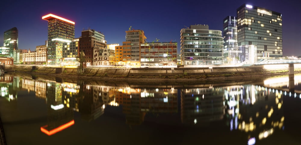 Buildings lit up at dusk Colorium Roggendorf Haus Hyatt Hotel Media Harbour Dusseldorf North Rhine Westphalia Germany Canvas Art - Panoramic Images (36 x 12)