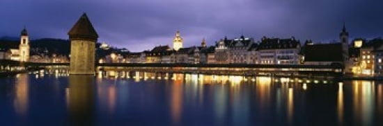 Buildings lit up at dusk Chapel Bridge Reuss River Lucerne Switzerland Canvas Art - Panoramic Images (36 x 12)