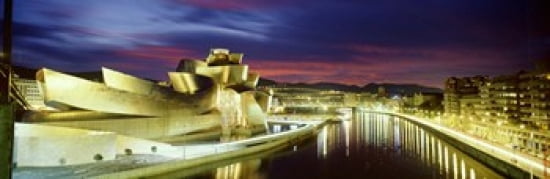 Buildings lit up at dusk Guggenheim Museum Bilbao Bilbao Vizcaya Spain Canvas Art - Panoramic Images (36 x 12)