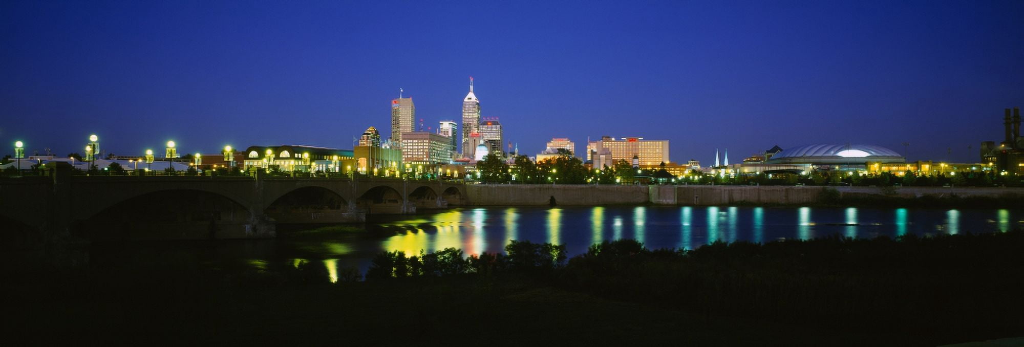 Buildings lit up at dusk Indianapolis Indiana USA Canvas Art - Panoramic Images (27 x 9)