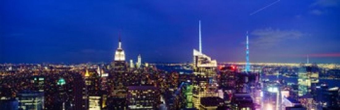 Buildings lit up at dusk Manhattan New York City New York State USA Canvas Art - Panoramic Images (18 x 6)