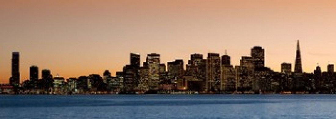 Buildings lit up at dusk San Francisco California USA 2010 Canvas Art - Panoramic Images (18 x 7)
