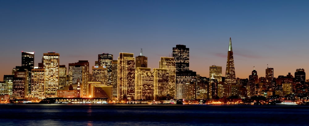 Buildings lit up at dusk San Francisco California USA Canvas Art - Panoramic Images (27 x 9)