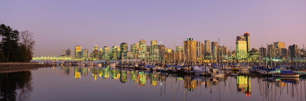 Buildings lit up at dusk Vancouver British Columbia Canada Canvas Art - Panoramic Images (27 x 9)