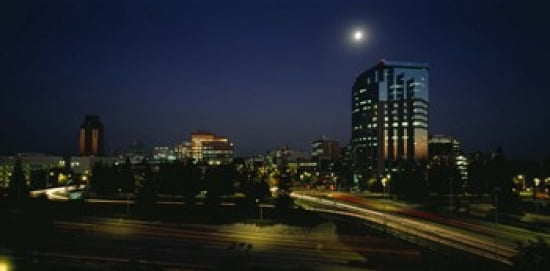 Buildings lit up at night Sacramento California USA Canvas Art - Panoramic Images (24 x 12)
