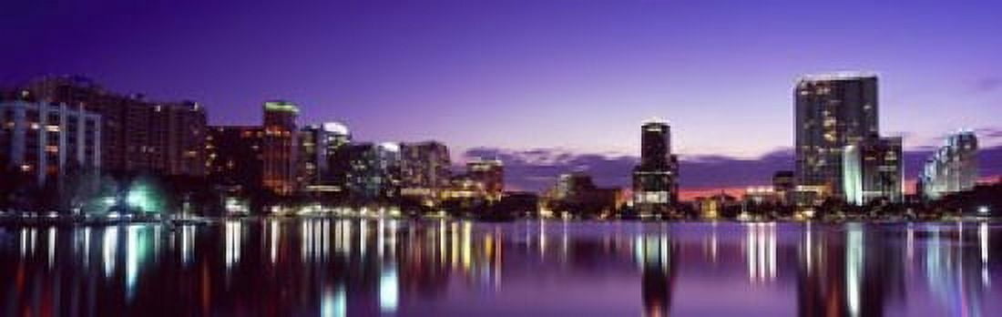 Buildings lit up at night in a city Lake Eola Orlando Orange County Florida USA 2010 Canvas Art - Panoramic Images (18 x 6)