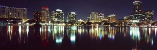 Buildings lit up at night in a city Lake Eola Orlando Orange County Florida USA 2010 Canvas Art - Panoramic Images (36 x 12)