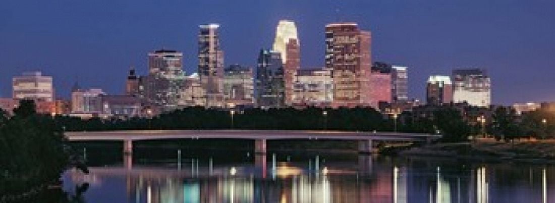 Buildings lit up at night in a city Minneapolis Mississippi River Hennepin County Minnesota USA Canvas Art - Panoramic Images (18 x 7)