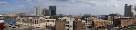 Buildings near a harbor Inner Harbor Baltimore Maryland USA 2009 Canvas Art - Panoramic Images (44 x 10)