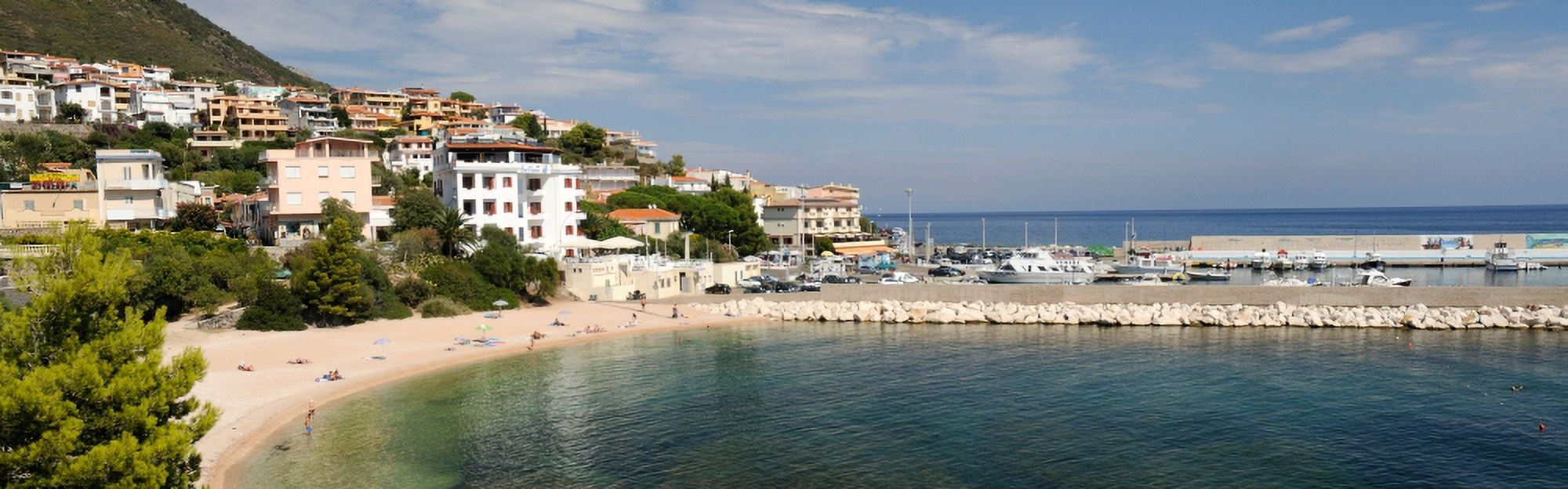 Buildings on the beach front Cala Gonone Harbor Cala Gonone Nuoro Sardinia Italy Canvas Art - Panoramic Images (36 x 12)